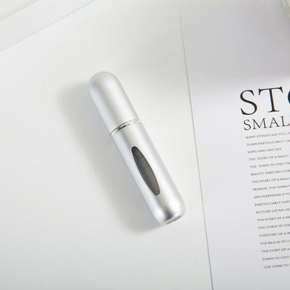 Bottom-fill perfume refill bottle with self-pump sprayer